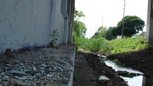 Underpass with running water in gulch