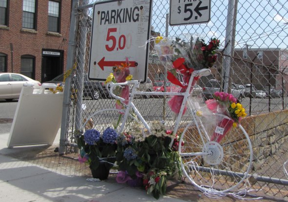 A “ghost bike” memorial in Sullivan Square where a 30-year old was struck and killed by a garbage truck, which then fled the scene.